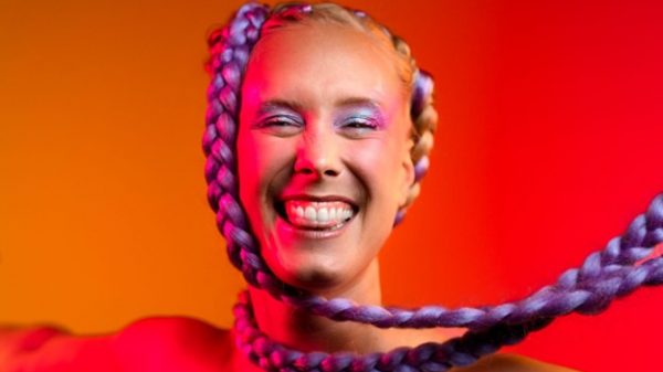 Norwegian artist and songwriter Mathilde SPZ, with bright braided hair and makeup, who released the new single 'Don’t Quit' with Ayko and George.